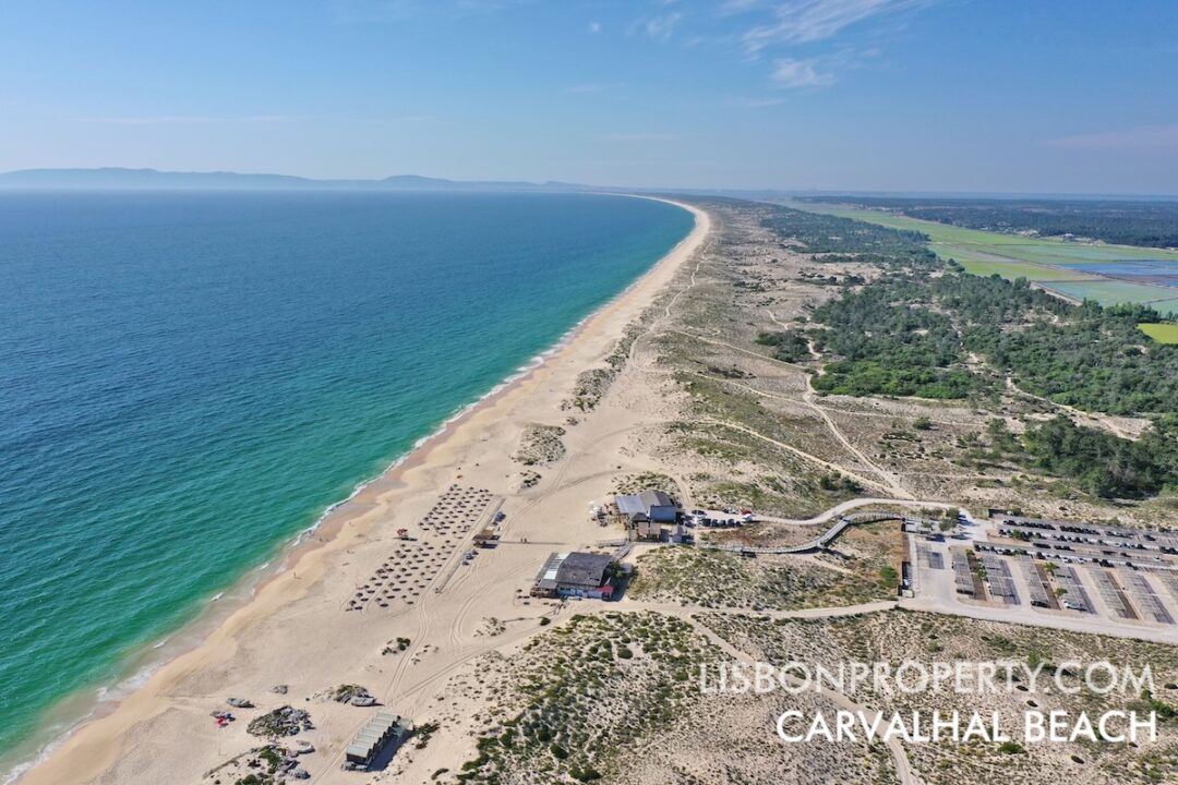 View of Carvalhal Beach taken from the south looking toward the north. The ocean is visible on the left side, and the rice fields appear on the right side.