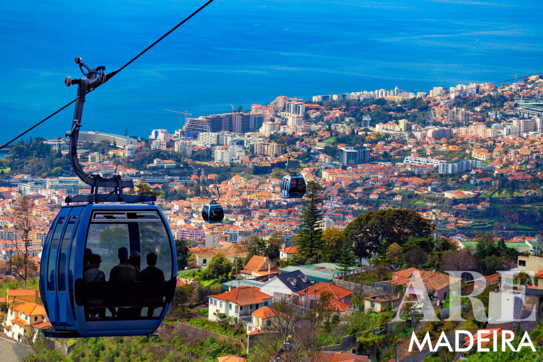 The Funchal Cable Car offers a scenic ride from Funchal to Monte, providing panoramic views of the city, coastline, and lush landscapes. The cable car itself is worth it for the views. It is a popular way to reach attractions like Monte Palace Madeira, the Madeira Botanical Garden, and the Carreiros do Monte Toboggans. (Paid ticket required)