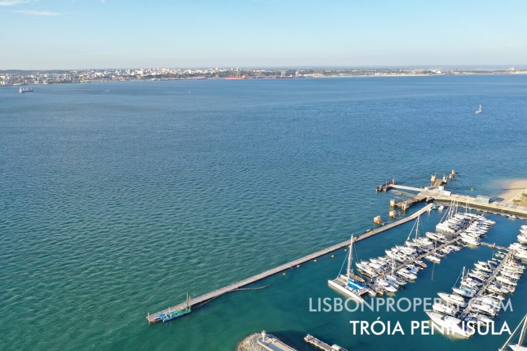 Tróia Peninsula is separated from the city of Setúbal by the Sado River, at a distance of approximately 3 km (1.86 miles). This view is taken from the Tróia Marina towards Setúbal