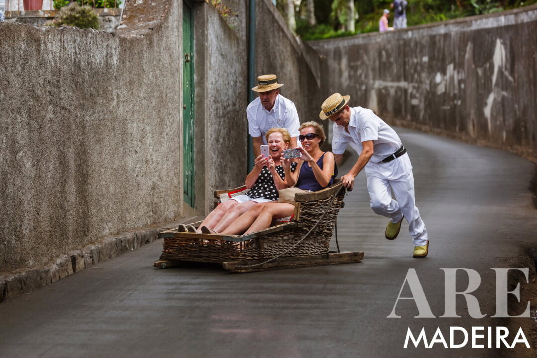 Carreiros do Monte Toboggans are a must-try attraction on Madeira Island. This 2-kilometer fun ride, led by skilled "Carreiros," takes you from the end of the Monte Cable Car in a handcrafted wicker basket for 2 or 3 people. These traditional sledges, made since the mid-1800s, are powered by two men in white outfits and straw hats, using their rubber-soled boots as brakes. It's a once-in-a-lifetime experience, offering a glimpse into the island's history of downhill public transportation. Remember, payments are cash only.