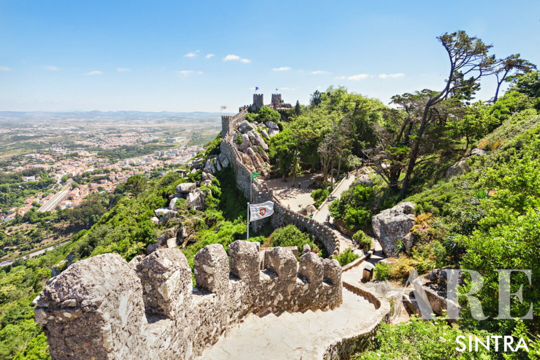 Located in Sintra atop a 466-meter elevation, the 8th-9th century Castelo dos Mouros offers panoramic views of the landscape and exemplifies Moorish military architecture with preserved ruins and watchtowers, encapsulating the area's historical significance and natural allure.