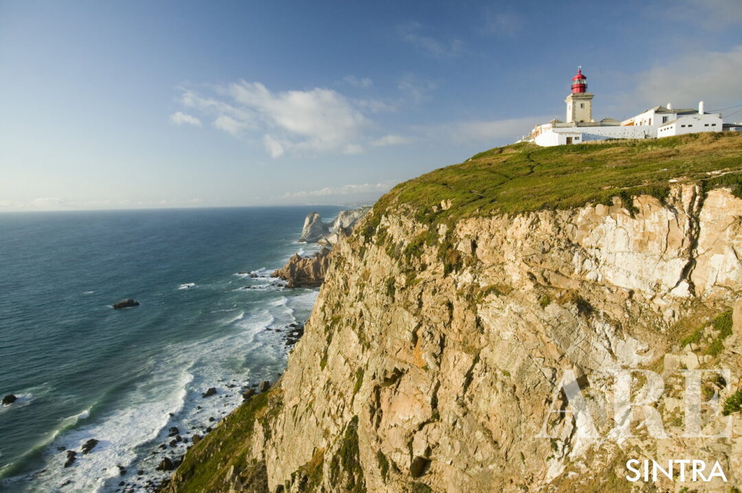 Cliffs and lighthouse of Cabo da Roca on the Atlantic Ocean in Sintra, Portugal, the westernmost point on the continent of Europe, "where the land ends and the sea begins".