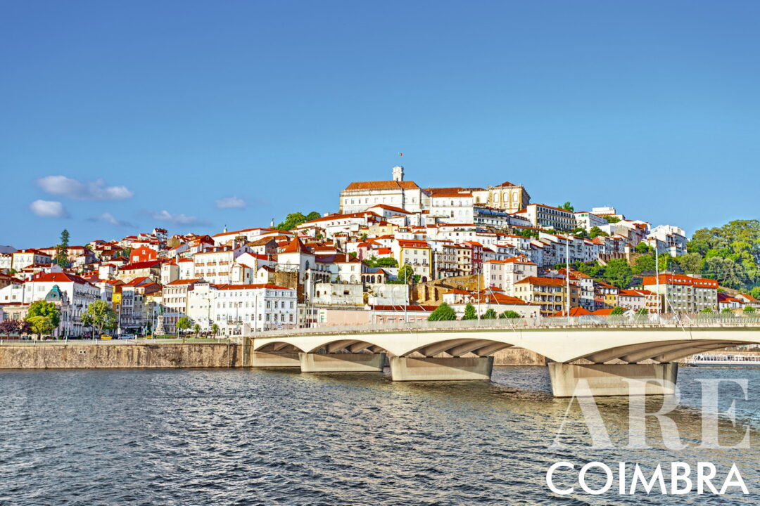 View of the city of Coimbra from the south bank of the Mondego River, with the Santa Clara bridge. At the top of the city we can see the clock tower and the buildings of the University of Coimbra. Founded in 1290, the University of Coimbra is the oldest university in Portugal, and one of the oldest in the world!