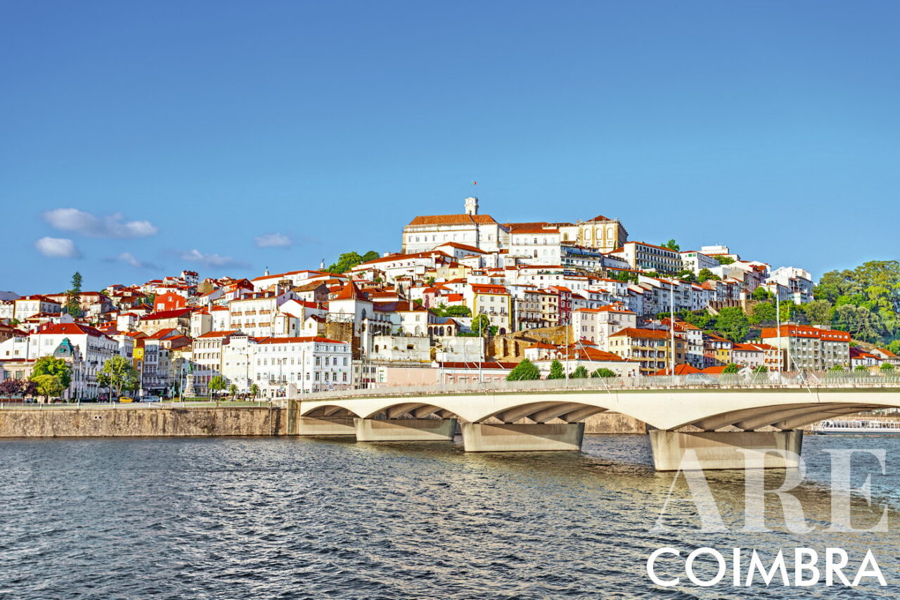 View of the city of Coimbra from the south bank of the Mondego River, with the Santa Clara bridge. At the top of the city we can see the clock tower and the buildings of the University of Coimbra. Founded in 1290, the University of Coimbra is the oldest university in Portugal, and one of the oldest in the world!